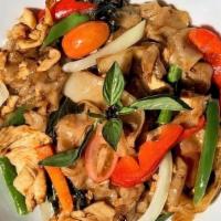 Drunken Noodle · Flat noodles, chicken, onions, bell peppers, green beans, tomatoes, and basil, stir-fried wi...