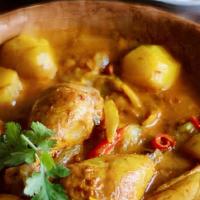 Yellow Curry With Jasmine Rice · Yellow curry paste in coconut milk, potatoes, sweet onion, carrots and green onions.