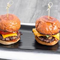 Angus Kalbi Sliders · Two marinated Angus beef patties, American cheese, lettuce, tomatoes, kimchi, caramelized on...