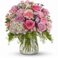 Your Light Shines By Teleflora · Bouquet will be delivered approximately as pictured.
This softly elegant gesture of condolen...