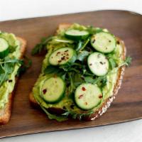 Avocado Toast · 2 slices of multigrain bread, avocado with a splash of lemon and topped with arugula, cucumb...