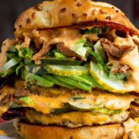 Double Clucker · Two ground chicken patties, cheddar bacon, avo, pickles, fried onions, burger sauce, artisan...