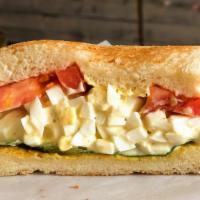 Egg Salad · Rich and creamy egg salad sandwich on your choice of house-made bread. Side of green salad o...