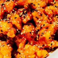 Sesame Chicken · Flash fried pieces of all-white meat chicken tossed in a sweet sesame sauce served with a si...