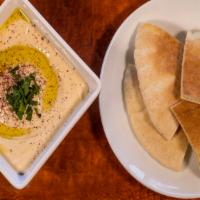 Pita & Hummus · Garbanzo beans blended with garlic, lemon juice, tahini and extra virgin olive oil. Served w...
