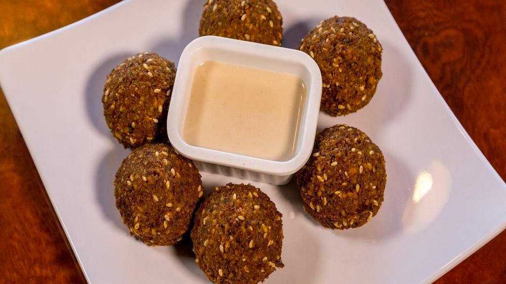 Falafel ( 6 ) · Vegan. Fresh ground chickpeas and our house blend of seasoning
deep fried to perfection.