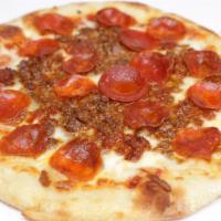 Carnivore Pizza · free range bolognese, nitrate free sausage & pepperoni, mozzarella, organic pizza sauce.