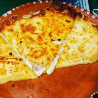 Cheese Quesadilla · Cheese melted on a flour tortilla.