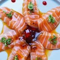 Salmon Carpaccio · Salmon sashimi, chive, yuzu dressing.