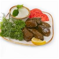 Stuffed Grape Leaves · 6 pcs - mixture of rice, lemon, dill, mint and spices, hand wrapped in grape leaves (gluten ...