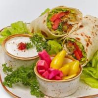 Freekeh Fritters Wrap · Wrapped with crispy onions, lettuce, tomatoes and parsley side of pickled turnip, chili pepp...