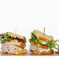 Turkey Club · Turkey, Applewood Smoked Bacon, Mixed Greens, Tomato, Avocado, Herb Aioli on Toasted Sourdou...