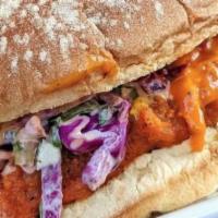 Spicy Chicken Sandwich · Crispy-Baked Chicken Breast smothered in our house spicy sauce, coleslaw, dill pickles on a ...