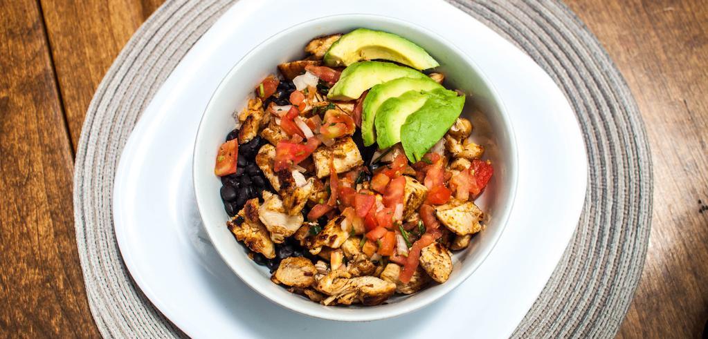 Baja Bowl · Gluten free. Your choice of meat over rice and black beans, avocado, pico de gallo and salsa tomatillo.