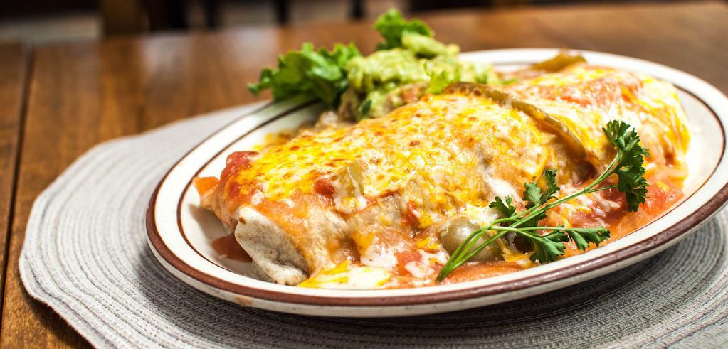 Azteca Burrito · Filled with shredded chicken, beef or Chile verde and beans. Smothered with salsa ranchera and melted cheese. Garnished with guacamole and sour cream.