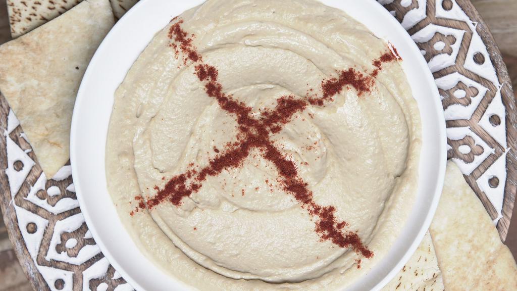 Hummus · Pureed garbanzo beans, fresh lemon, garlic spread, olive oil, tahini sauce are combined to delectable.