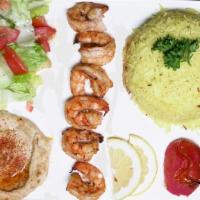 Grilled Shrimp · Tiger shrimp smothered in lemon, garlic sauce and grilled to perfection. served with rice,hu...