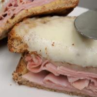 Croque Monsieur · French version of a toasted ham and Swiss cheese sandwich with dijon mustard.