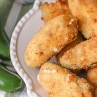 Stuffed Jalapeno Poppers · Mild breaded jalapeños stuffed with cream cheese. Served with your choice ranch or marianara.