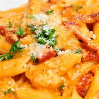 Romano’S · Penne pasta, grilled chicken, artichoke hearts and sundried tomatoes tossed with creamy mari...
