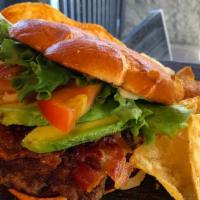 Bacon Avocado Burger · Smashed ground beef patty with mayo, avocado, crispy bacon, lettuce and tomato on a toasted ...