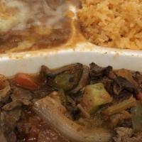 #3-Steak Picado · Served with rice, beans, salad and tortillas. Top sirloin cut into smaller pieces sauteed wi...