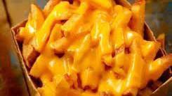 Cheese Fries · Traditional fresh cut french fries covered in melted cheese.