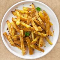 Gar-Lick The Fries · (Vegetarian) Idaho potato fries cooked until golden brown and garnished with salt, and garli...