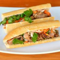 Banh Mi Thit/Pork · Grilled Pork 12” baguette warm french baguette served with house mayo, pickled. carrots/daik...