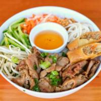 Bun Thit Cha Gio/Pork & Eggrolls · Grilled Pork and Crispy Eggroll with cold vermicelli noodles served on a bed of lettuce, fre...