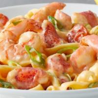 Lobster & Shrimp Fettuccine · Maine Lobster, shrimp, fresh fettuccine, roasted grape tomatoes & green onions in a light cr...