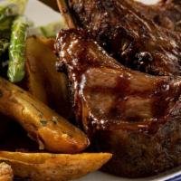 Lamb Chops* · New Zealand double-cut chops, grilled asparagus, roasted fingerling potatoes.