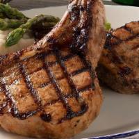 Tuscan Grilled Pork Chops*  · Bone-in, center-cut chops, mashed potatoes, broccolini® .
