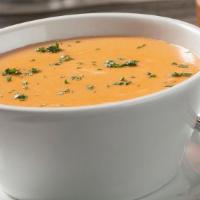 Lobster Bisque · A light cream lobster bisque with a touch of sherry.