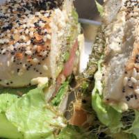 Golden Garden Vegetarian · Spinach bagel with veggie spread, lettuce, tomatoes, alfalfa sprouts, cucumbers, and avocado.