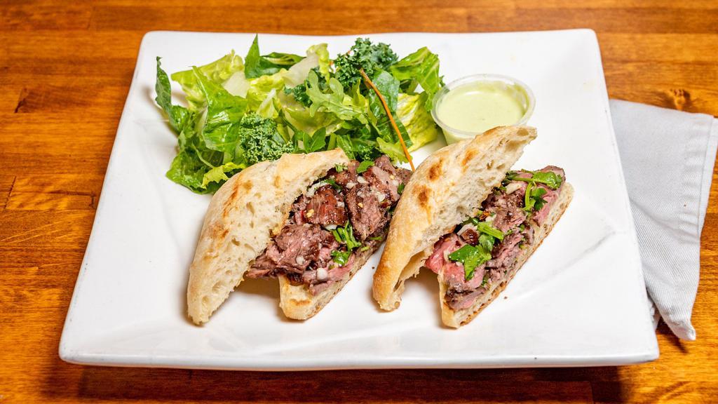 Steve'S Steak Sandwich · Our most popular sandwich! Prime beef, grilled medium rare, thinly sliced and loaded onto a torta. Topped with a spicy peruvian chimichurri sauce.