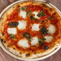 Margherita Pizza Classic · Fresh local mozzarella, grated Grana Padano, tomato sauce, basil and extra virgin olive oil