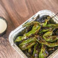 Shishito Peppers · Fire roasted shishito peppers seasoned with toasted sesame seeds served with yuzu aioli dipp...