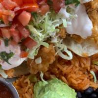 Baja Fish Tacos · Two beer-battered Icelandic cod, cabbage, pico de gallo, guacamole, Baja white sauce on flou...