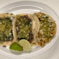 Street Tacos · 1 taco soft double corn tortilla choice of chicken, pastor or carnitas with cilantro, onions...