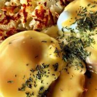 Eggs Benedict · Traditional Egg's Benedict with poached eggs on english muffin topped with creamy Hollandais...