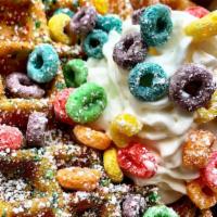 Froot Loops Waffle · Cereal infused crispy waffle topped with fresh berries... even more cereal. Topped with powd...
