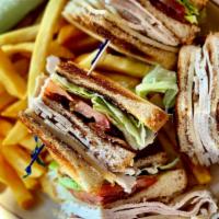 Turkey Club Sandwich · Turkey breast, bacon, lettuce, tomato & cheese on choice of bread. Served with choice of side.