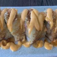 Crunch Roll · Inside: shrimp tempura, avocado, cucumber and crab. Outside: tempura flakes, spicy mayo and ...