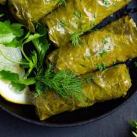 Grape Leaves · Veggie grape leaves, stuffed with rice, tomato, onions, parsley and fresh lemon juice.