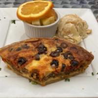 Quiche Aux Olives · Vegetarian. Kalamata Greek olives, sun-dried tomatoes, organic caramelized onions and eggs.