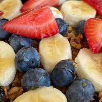 Acai Yogurt · Housemade granola, Acai, yogurt, berries, bananas and honey.