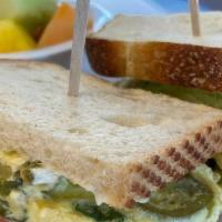 Javi’S Breakfast Sandwich · 2 scrambled eggs, jalapeno, tomatoes, mayonnaise, cilantro, feta cheese,. and avocado on you...
