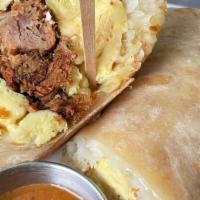 Pulled Pork Burrito · Scrambled eggs, pulled pork, monterey jack cheese, hash browns and housemade chiliquilles sa...