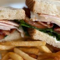 Turkey Club · Oven Roasted Turkey Breast, applewood smoked bacon, lettuce, tomatoes, avocado, provolone ch...